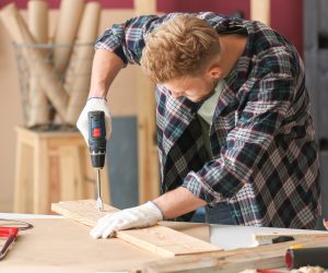 Male carpenter working in shop